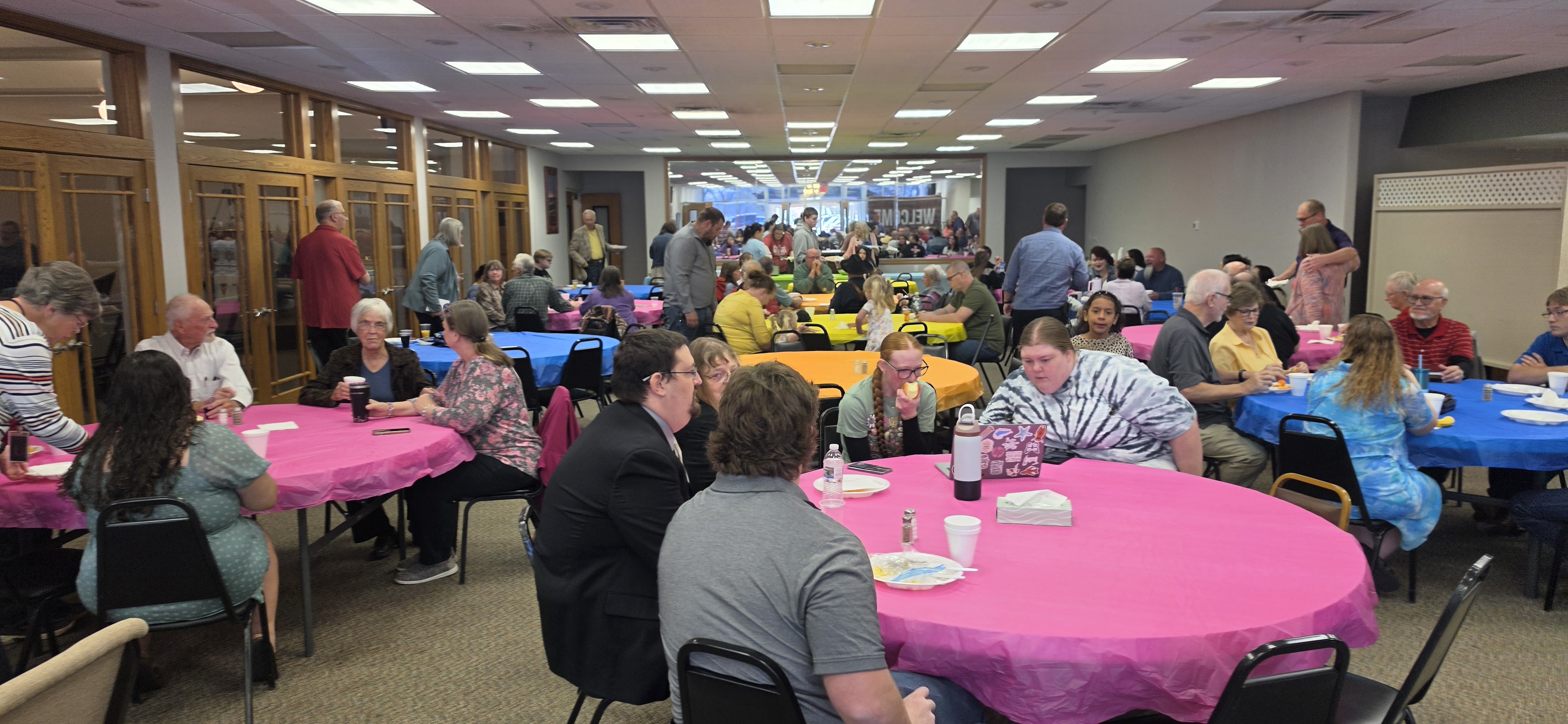 People enjoying a church fellowship meal and event